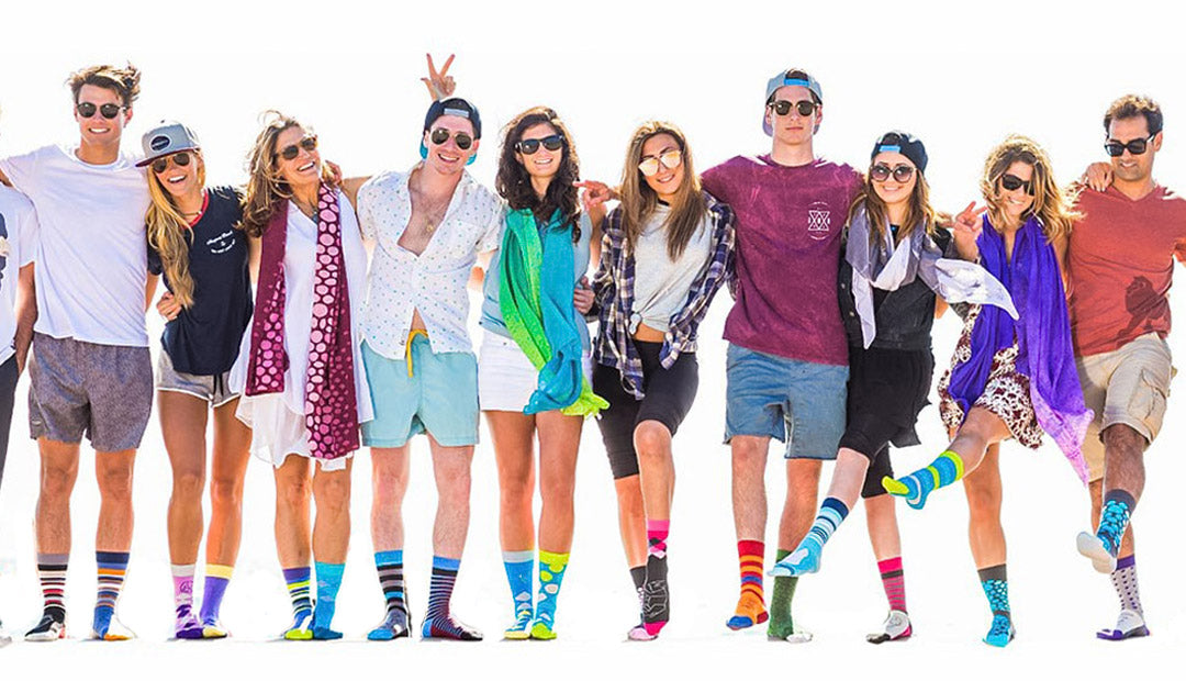 Shongolulu styles modeled by men and women wearing boxer shorts, scarves, socks with animal prints