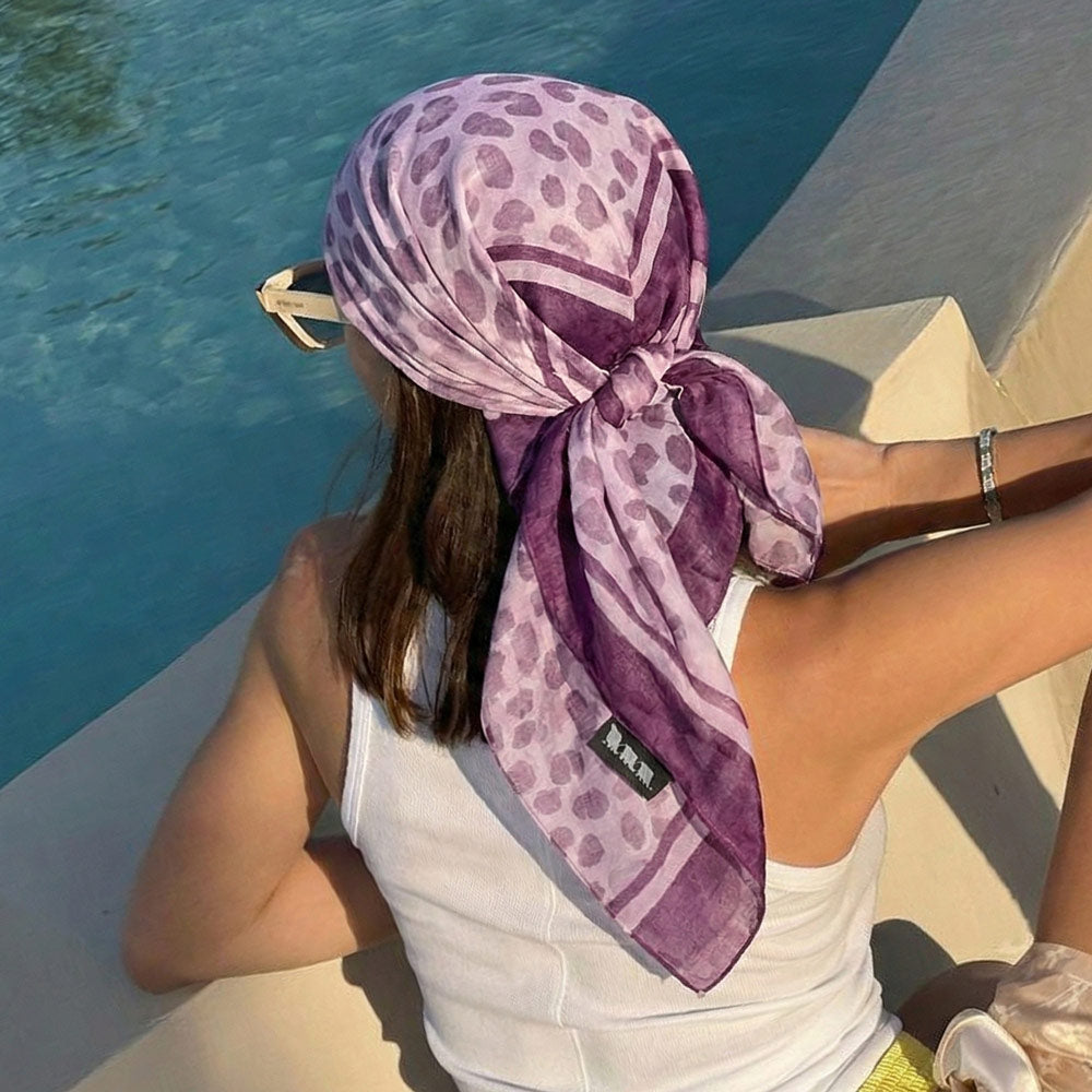 Woman wearing the Purple Cheetah print scarf