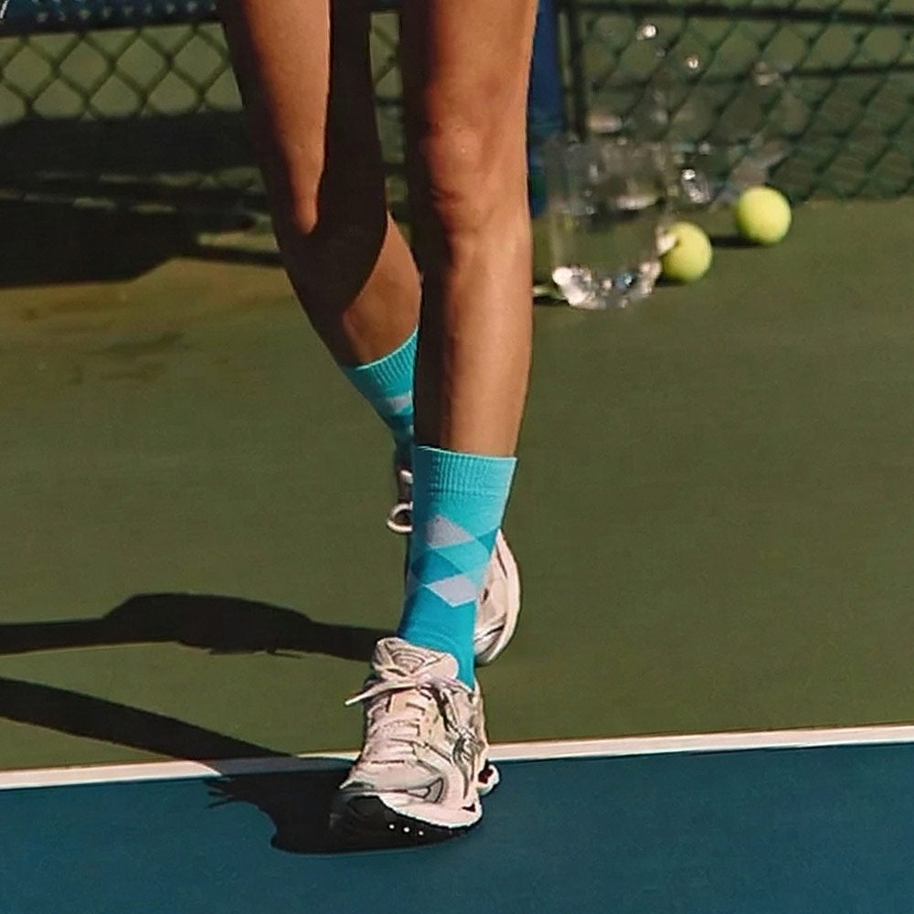 Ellie the Elephant Print Blue Argyle socks worn by female tennis player