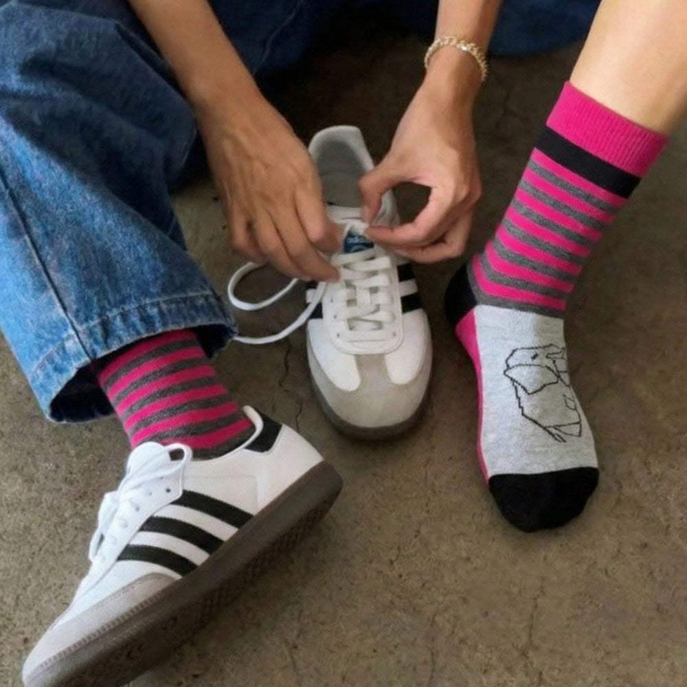 young woman wearing elephant print striped socks