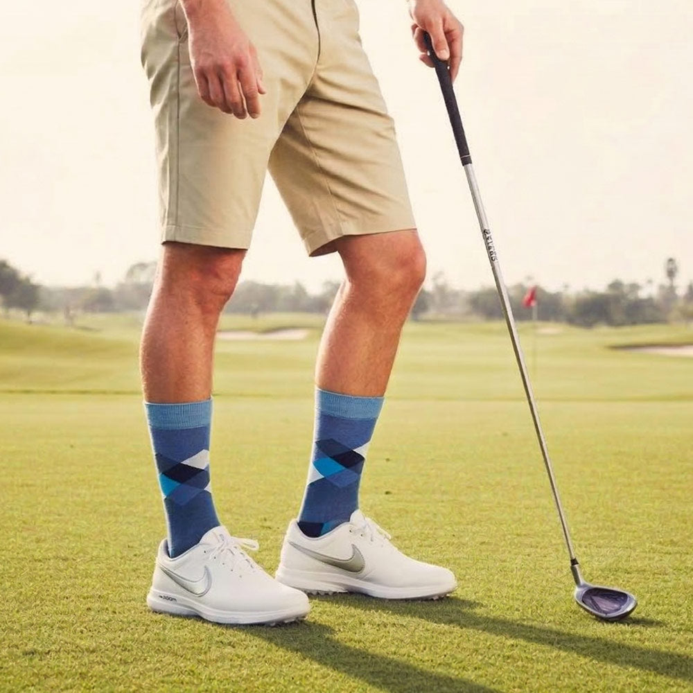 Shongolulu blue argyle socks with elephant print on male golfer