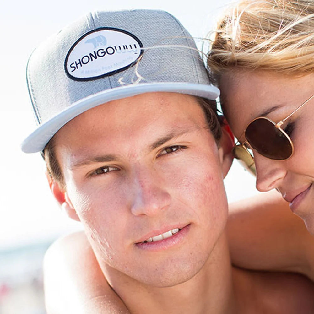 young man wearing a Shongolulu flat brim baseball cap