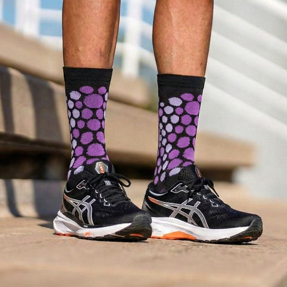 purple cheetah print socks with running shoes