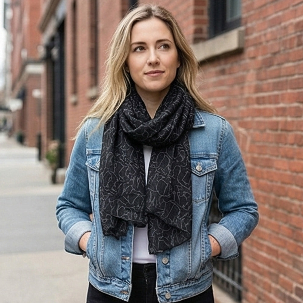 young woman wearing the grey rhino print scarf