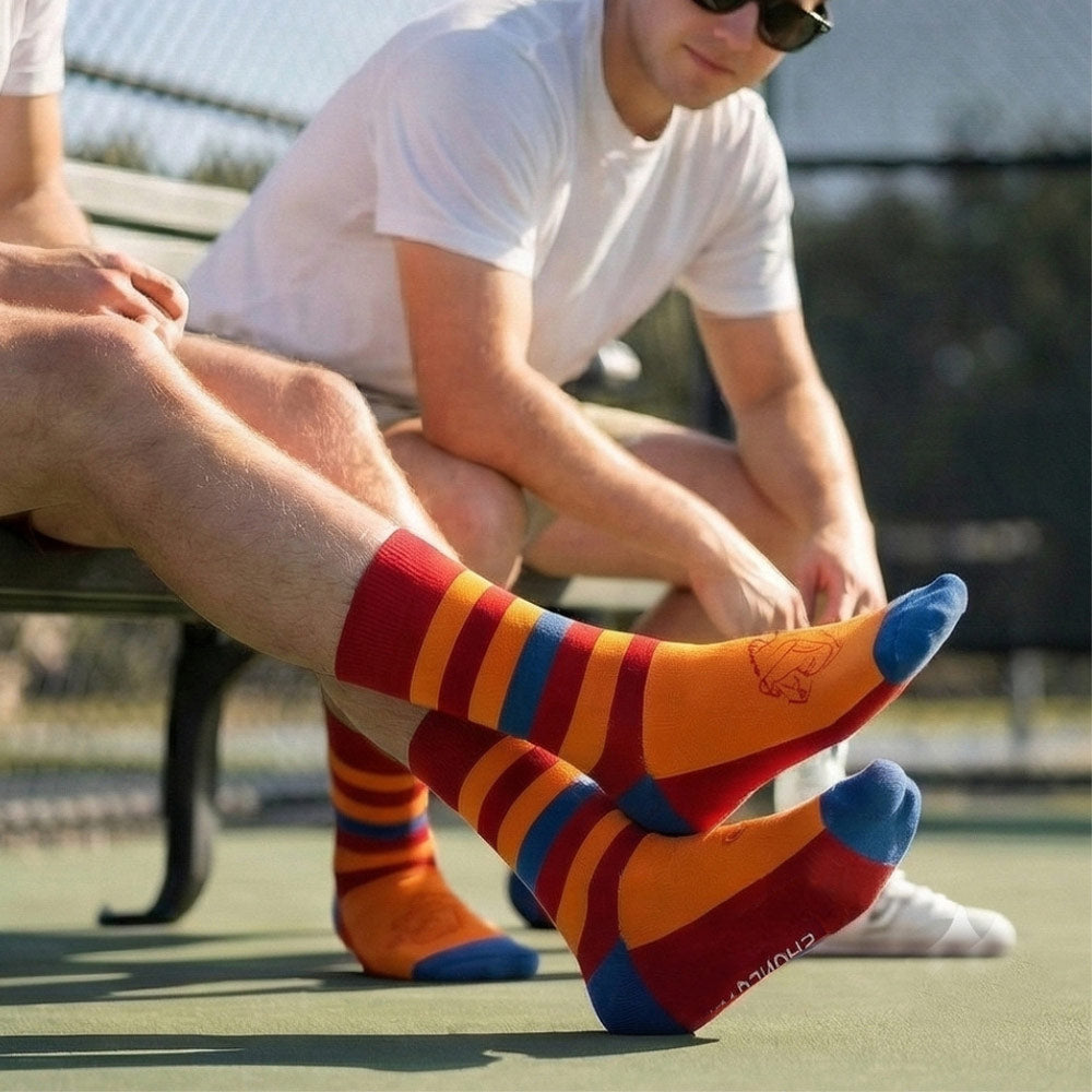 Shongolulu Lion print socks in orange red and blue stripes
