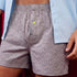 Grey Rhino Print Boxer Shorts shown worn with a light blue button down dress shirt