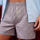 Grey Rhino Print Boxer Shorts shown worn with a light blue button down dress shirt