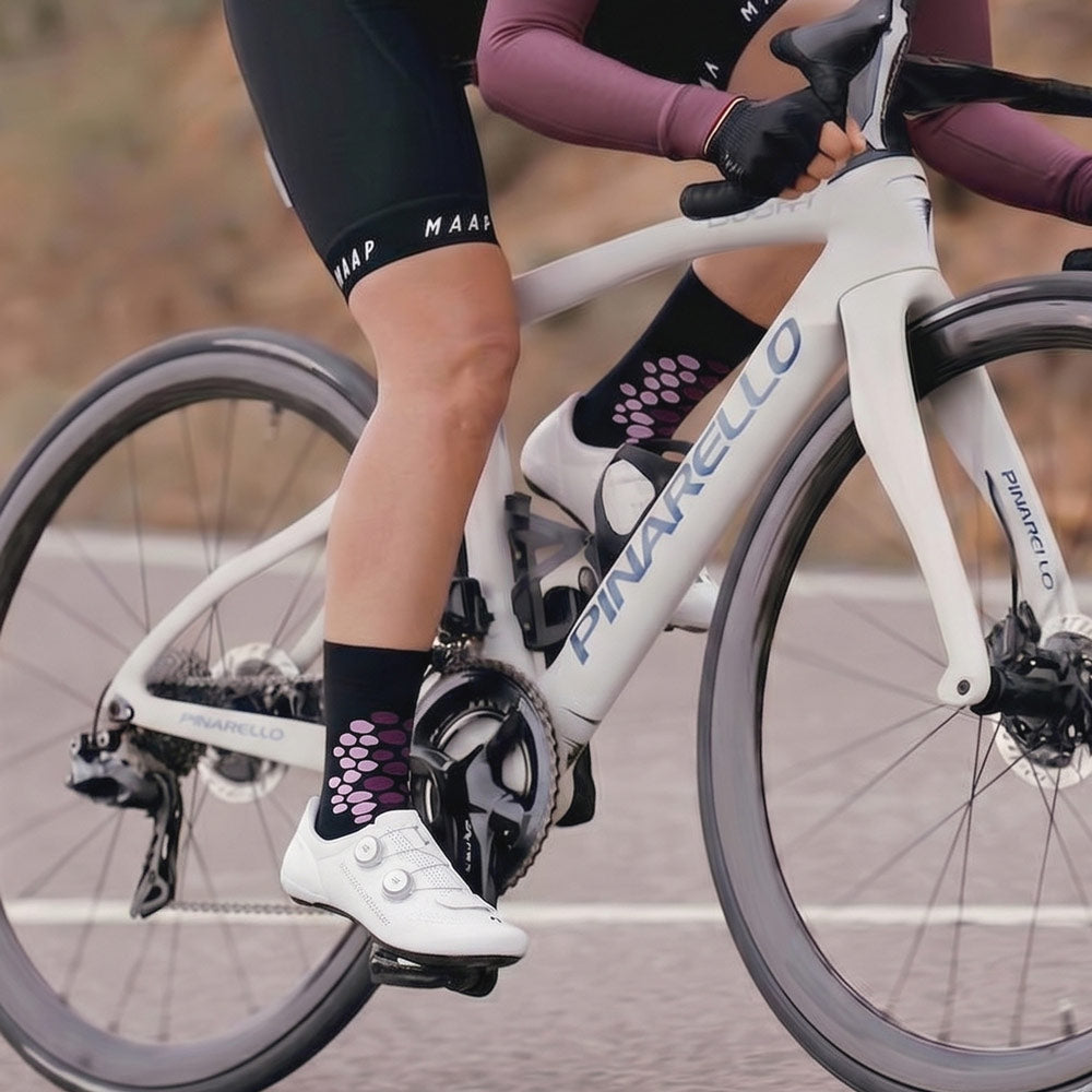 purple cheetah print sock worn by female cyclist